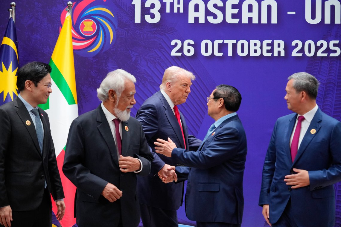 President Donald Trump, centre left, shakes hands with Vietnam's Prime Minister Pham Minh Chinh, as East Timor's Prime Minister Kay Rala Xanana Gusmao, second from left and Singapore's Prime Minister Lawrence Wong look at the ASEAN US Summit in Kuala Lumpur, Malaysia, Sunday, Oct. 26, 2025. (AP Photo/Vincent Thian, Pool) President Donald Trump, centre left, shakes hands with Vietnam's Prime Minister Pham Minh Chinh, as East Timor's Prime Minister Kay Rala Xanana Gusmao, second from left and Singapore's Prime Minister Lawrence Wong look at the ASEAN US Summit in Kuala Lumpur, Malaysia, Sunday, Oct. 26, 2025. (AP Photo/Vincent Thian, Pool)