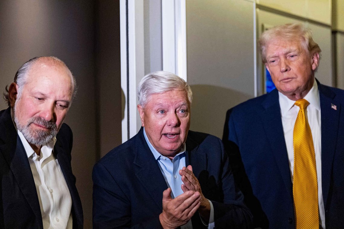 President Donald Trump, accompanied by Commerce Secretary Howard Lutnick, left, and Sen. Lindsey Graham, R-S.C., speaks with reporters while in flight on Air Force One, Sunday, Jan. 4, 2026, as returning to Joint Base Andrews, Md. (AP Photo/Alex Brandon) President Donald Trump, accompanied by Commerce Secretary Howard Lutnick, left, and Sen. Lindsey Graham, R-S.C., speaks with reporters while in flight on Air Force One, Sunday, Jan. 4, 2026, as returning to Joint Base Andrews, Md. (AP Photo/Alex Brandon)