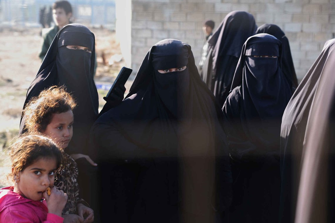 People stand inside the al-Hol camp in northeastern Syria's Hasakeh province, Syria, Wednesday, Jan. 21, 2026, after the withdrawal of the Syrian Democratic Forces (SDF). (AP Photo/Ghaith Alsayed) People stand inside the al-Hol camp in northeastern Syria's Hasakeh province, Syria, Wednesday, Jan. 21, 2026, after the withdrawal of the Syrian Democratic Forces (SDF). (AP Photo/Ghaith Alsayed)