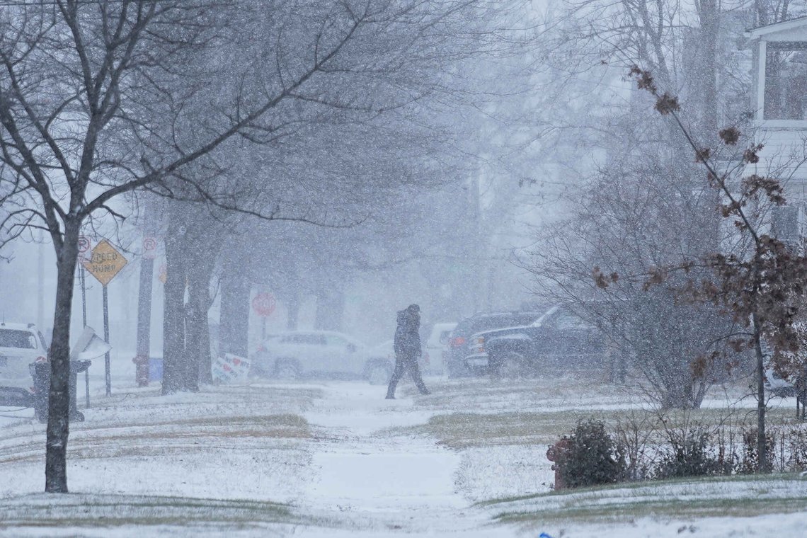A person walks across the street after a winter storm system hit South East Michigan, Monday, Dec. 29, 2025, in Detroit. (AP Photo/Ryan Sun) A person walks across the street after a winter storm system hit South East Michigan, Monday, Dec. 29, 2025, in Detroit. (AP Photo/Ryan Sun)