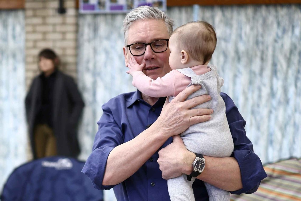 Britain's Prime Minister Keir Starmer holds five-month-old Lilah Taylor during a visit to a "family hub" at St. Mary's Church Hall in Goldington, Bedfordshire, north of London, Thursday, Jan. 8, 2026. (Henry Nicholls/Pool Photo via AP) Britain's Prime Minister Keir Starmer holds five-month-old Lilah Taylor during a visit to a "family hub" at St. Mary's Church Hall in Goldington, Bedfordshire, north of London, Thursday, Jan. 8, 2026. (Henry Nicholls/Pool Photo via AP)
