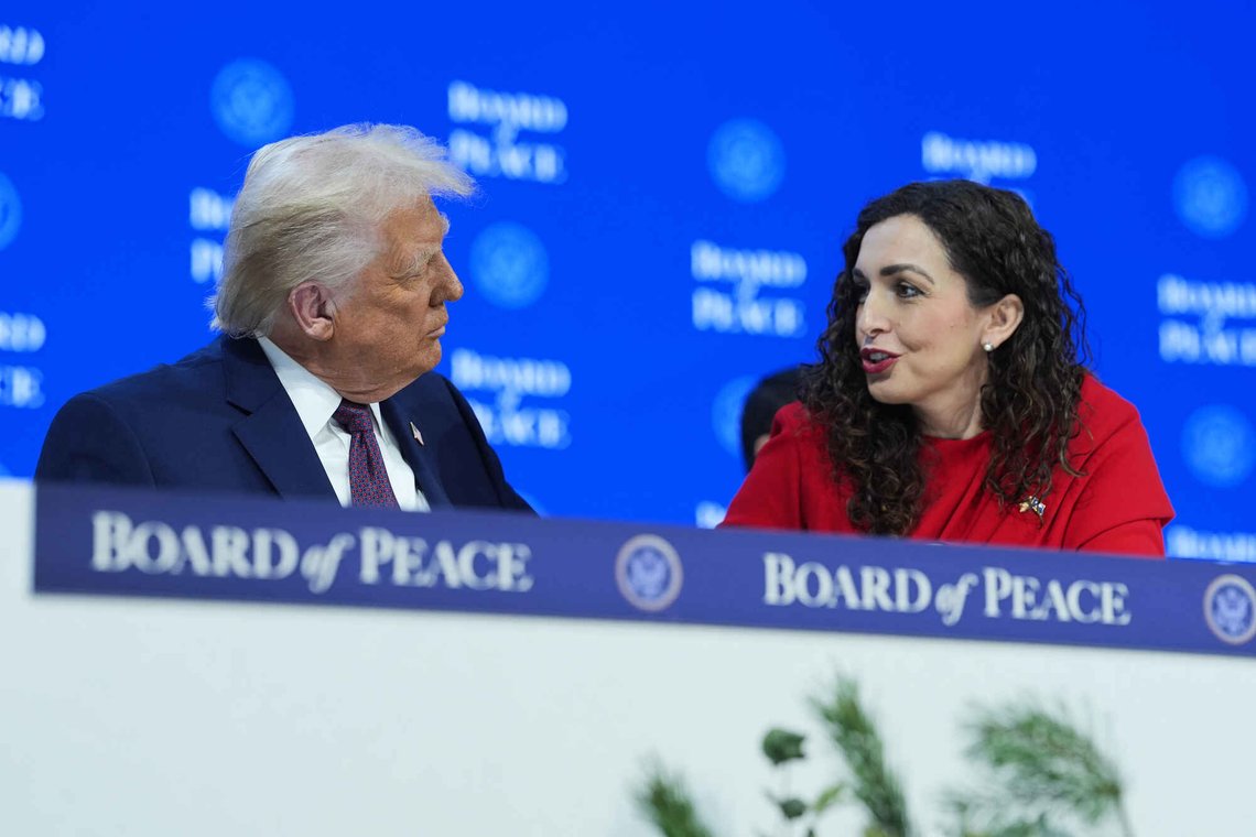 President Donald Trump, left, speaks with Kosovo's President Vjosa Osmani-Sadriu during a signing of the Board of Peace charter during the Annual Meeting of the World Economic Forum in Davos, Switzerland, Thursday, Jan. 22, 2026. (AP Photo/Evan Vucci) President Donald Trump, left, speaks with Kosovo's President Vjosa Osmani-Sadriu during a signing of the Board of Peace charter during the Annual Meeting of the World Economic Forum in Davos, Switzerland, Thursday, Jan. 22, 2026. (AP Photo/Evan Vucci)