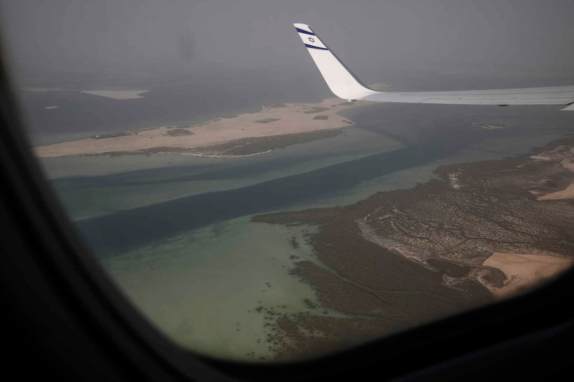 A wing tip with the Star of David is visible through the window of an Israeli El Al airliner just before the plane lands in Abu Dhabi, United Arab Emirates, Monday, Aug. 31, 2020. The El Al plane landed in Abu Dhabi after flying in from Israel, carrying a high-ranking American and Israeli delegation to Abu Dhabi in the first-ever direct commercial passenger flight to the United Arab Emirates. The Israeli flag carrier’s flight Monday marks the implementation of the historic U.S.-brokered deal to normalize relations between the two nations. (Nir Elias/Pool Photo via AP) A wing tip with the Star of David is visible through the window of an Israeli El Al airliner just before the plane lands in Abu Dhabi, United Arab Emirates, Monday, Aug. 31, 2020. The El Al plane landed in Abu Dhabi after flying in from Israel, carrying a high-ranking American and Israeli delegation to Abu Dhabi in the first-ever direct commercial passenger flight to the United Arab Emirates. The Israeli flag carrier’s flight Monday marks the implementation of the historic U.S.-brokered deal to normalize relations between the two nations. (Nir Elias/Pool Photo via AP)