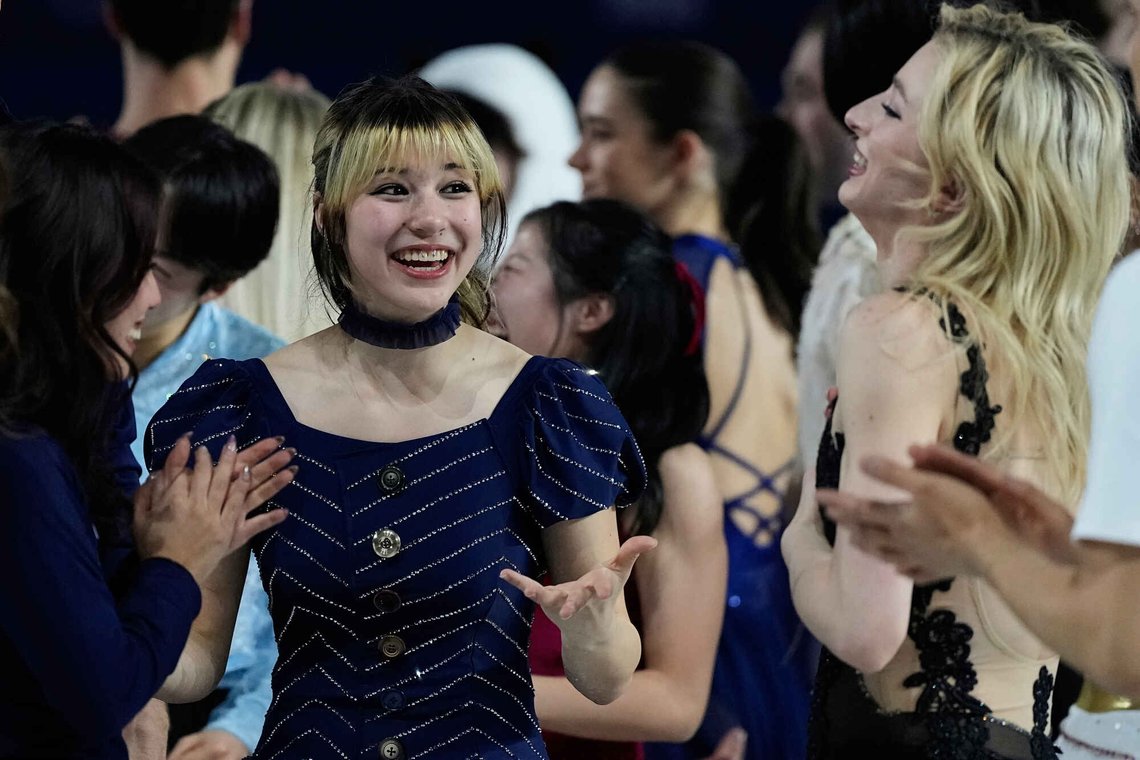 Alysa Liu of the United States, center, reacts with other athletes after performing in the figure skating exhibition at the 2026 Winter Olympics, in Milan, Italy, Saturday, Feb. 21, 2026. (AP Photo/Ashley Landis) Alysa Liu of the United States, center, reacts with other athletes after performing in the figure skating exhibition at the 2026 Winter Olympics, in Milan, Italy, Saturday, Feb. 21, 2026. (AP Photo/Ashley Landis)