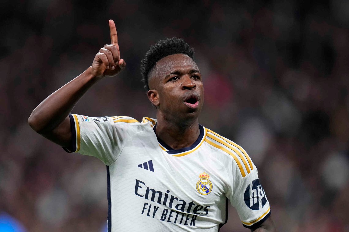 FILE - Real Madrid's Vinicius Junior celebrates after scoring his side's opening goal during the Champions League round of 16 second leg soccer match between Real Madrid and RB Leipzig at the Santiago Bernabeu stadium in Madrid, Spain, Wednesday, March 6, 2024. (AP Photo/Manu Fernandez, File) FILE - Real Madrid's Vinicius Junior celebrates after scoring his side's opening goal during the Champions League round of 16 second leg soccer match between Real Madrid and RB Leipzig at the Santiago Bernabeu stadium in Madrid, Spain, Wednesday, March 6, 2024. (AP Photo/Manu Fernandez, File)