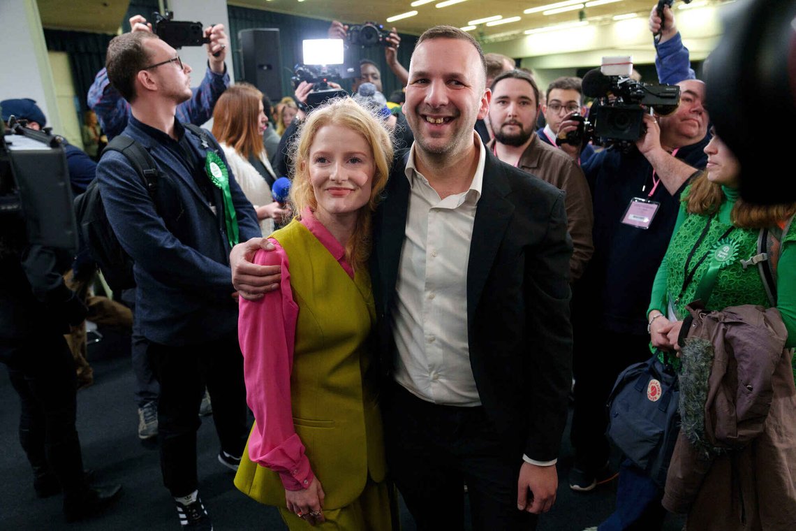 CORRECTS DATE - Greens Party candidate Hannah Spencer, left, stands with party leader Zack Polanski after winning the Gorton and Denton by-election, Manchester, England, Friday, Feb. 27, 2026. (AP Photo/Jon Super) CORRECTS DATE - Greens Party candidate Hannah Spencer, left, stands with party leader Zack Polanski after winning the Gorton and Denton by-election, Manchester, England, Friday, Feb. 27, 2026. (AP Photo/Jon Super)