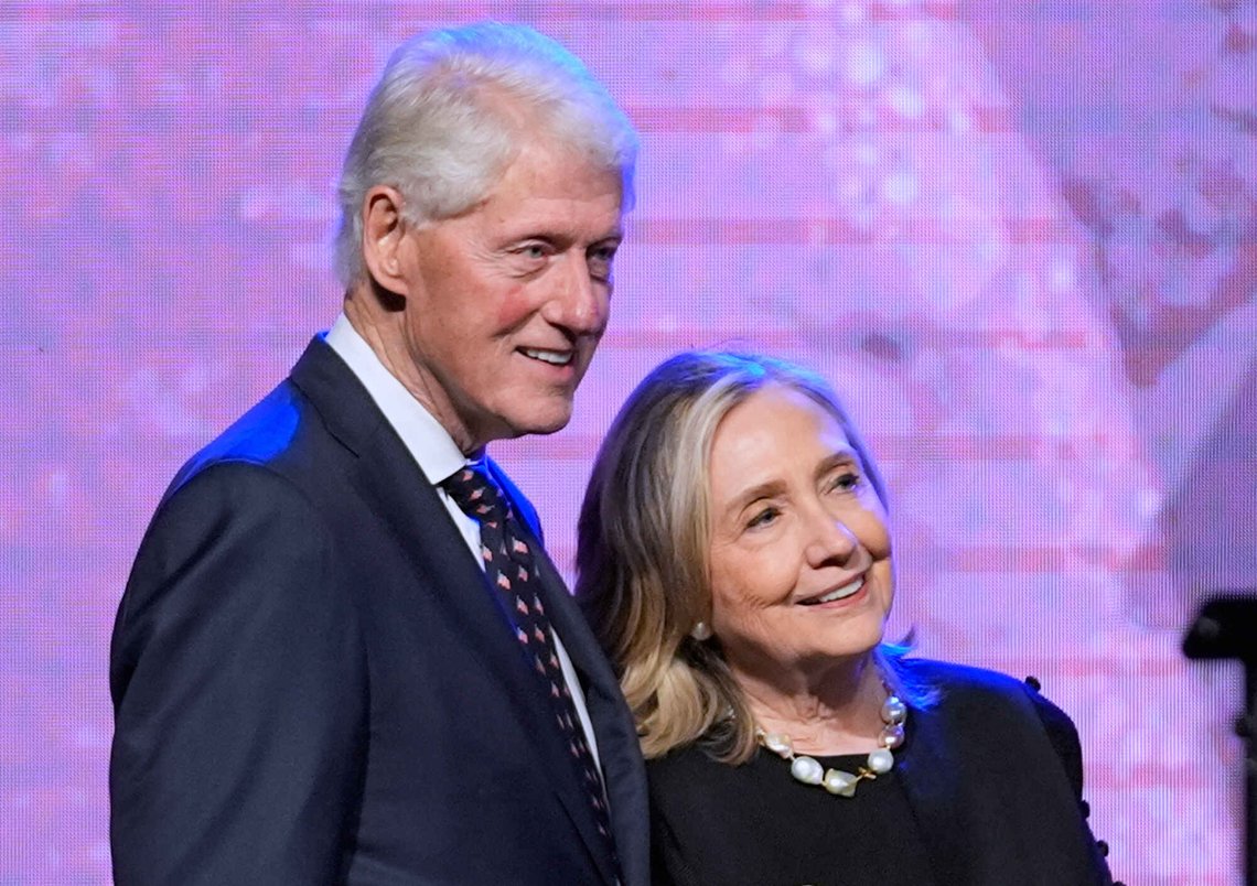 FILE - Former President Bill Clinton, left, and former Secretary of State Hillary Clinton listen as Vice President Kamala Harris delivers a eulogy for U.S. Rep. Sheila Jackson Lee, Aug. 1, 2024, in Houston. (AP Photo/LM Otero, File) FILE - Former President Bill Clinton, left, and former Secretary of State Hillary Clinton listen as Vice President Kamala Harris delivers a eulogy for U.S. Rep. Sheila Jackson Lee, Aug. 1, 2024, in Houston. (AP Photo/LM Otero, File)
