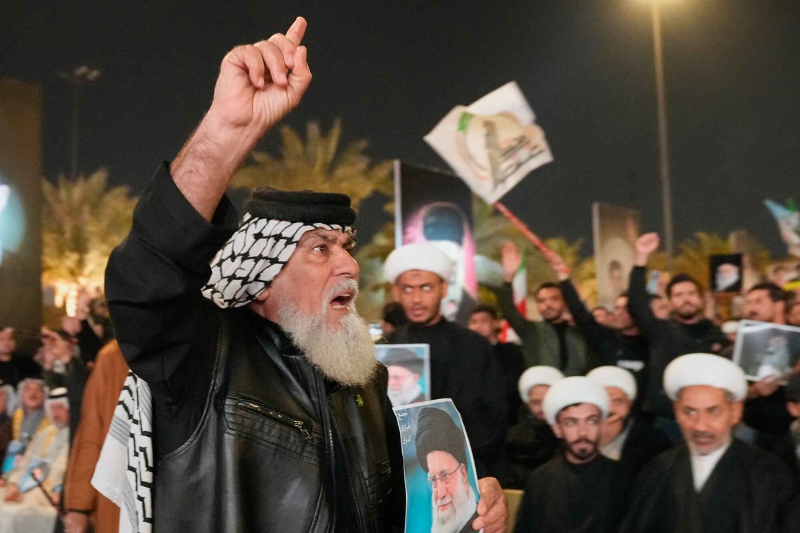 An Iraqi Shiite cleric holds a portrait of Iran's Supreme Leader Ayatollah Ali Khamenei, who was killed by a U.S. airstrike in Tehran, during a symbolic funeral in Baghdad, Iraq, Friday, March 6, 2026. (AP Photo/Hadi Mizban) An Iraqi Shiite cleric holds a portrait of Iran's Supreme Leader Ayatollah Ali Khamenei, who was killed by a U.S. airstrike in Tehran, during a symbolic funeral in Baghdad, Iraq, Friday, March 6, 2026. (AP Photo/Hadi Mizban)