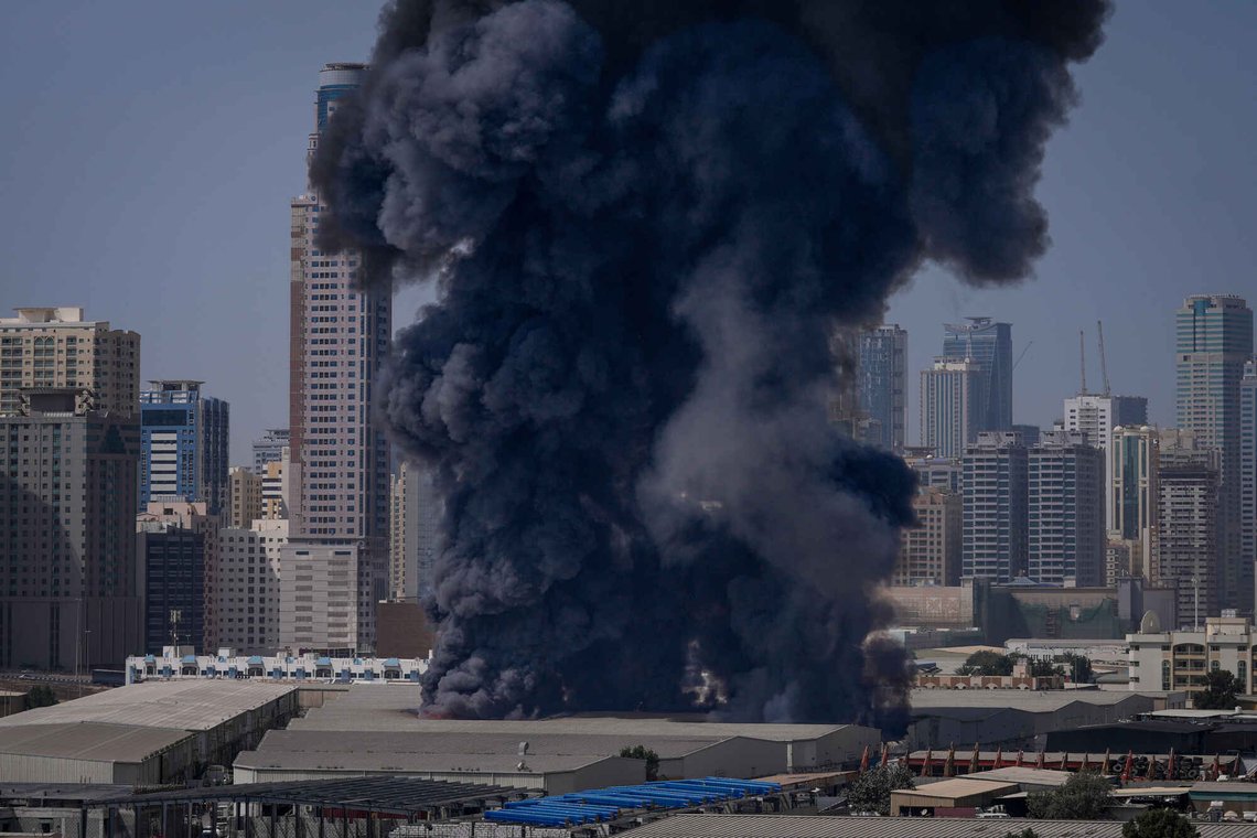FILE - A black plume of smoke rises from a warehouse in the industrial area of Sharjah City following reports of Iranian strikes in Dubai, United Arab Emirates, on March 1, 2026. (AP Photo/Altaf Qadri, File) FILE - A black plume of smoke rises from a warehouse in the industrial area of Sharjah City following reports of Iranian strikes in Dubai, United Arab Emirates, on March 1, 2026. (AP Photo/Altaf Qadri, File)