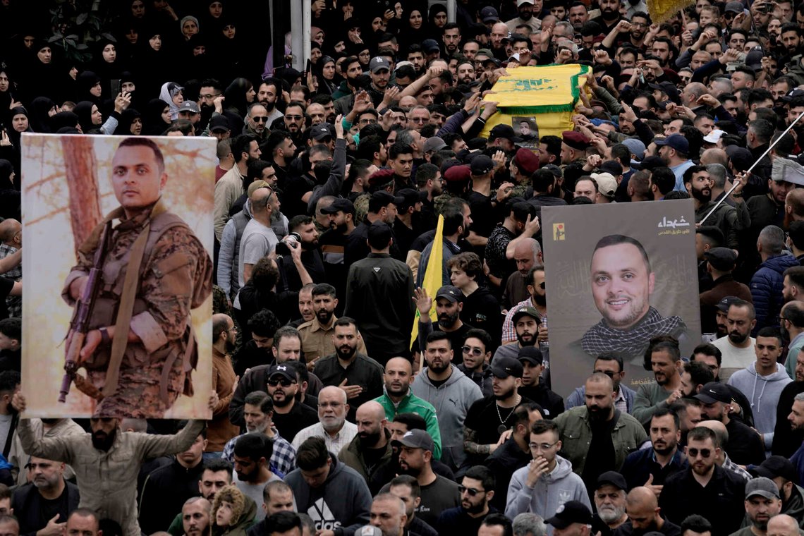 Hezbollah fighters carry the coffin of their comrade, Ali Ahmad Hussein, who was killed by an Israeli strike in south Lebanon, during his funeral procession in the southern Beirut suburb of Dahiyeh, Lebanon, Monday, April 8, 2024. Israel's military says it has killed a commander of Hezbollah's secretive Radwan Force in southern Lebanon. (AP Photo/Bilal Hussein) Hezbollah fighters carry the coffin of their comrade, Ali Ahmad Hussein, who was killed by an Israeli strike in south Lebanon, during his funeral procession in the southern Beirut suburb of Dahiyeh, Lebanon, Monday, April 8, 2024. Israel's military says it has killed a commander of Hezbollah's secretive Radwan Force in southern Lebanon. (AP Photo/Bilal Hussein)