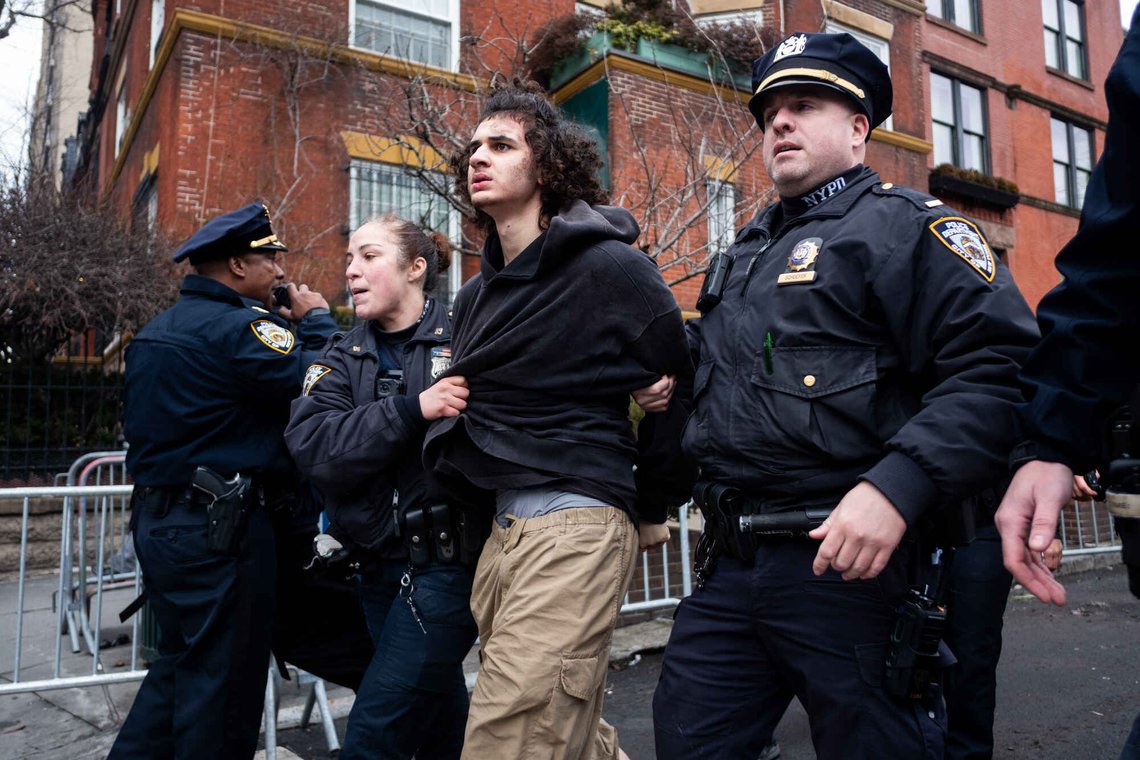 Police detain Emir Balat after he attempted to detonate an improvised explosive device during a counterprotest against far right influencer Jake Lang staging an anti-Islam protest outside Gracie Mansion, Saturday, March 7, 2026, in New York. (AP Photo/Julius Constantine Motal) Police detain Emir Balat after he attempted to detonate an improvised explosive device during a counterprotest against far right influencer Jake Lang staging an anti-Islam protest outside Gracie Mansion, Saturday, March 7, 2026, in New York. (AP Photo/Julius Constantine Motal)