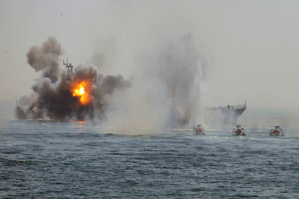 In this photo released by the semi-official Iranian Fars News Agency, Revolutionary Guard's boats, right, attack an abandoned war ship, being used as a target, during a maneuver in the Persian Gulf, Iran, Thursday, April 22, 2010. Iran's elite Revolutionary Guard on Thursday started large-scale war games in the Persian Gulf and the strategic Strait of Hormuz, state television reported. Iran has been holding military maneuvers in the gulf and the Strait of Hormuz annually since 2006 to show off its military capabilities. (AP Photo/Fars News Agency,Mehdi Marizad) ** EDS NOTE: THE ASSOCIATED PRESS HAS NO WAY OF INDEPENDENTLY VERIFYING THE CONTENT, LOCATION OR DATE OF THIS IMAGE. ** In this photo released by the semi-official Iranian Fars News Agency, Revolutionary Guard's boats, right, attack an abandoned war ship, being used as a target, during a maneuver in the Persian Gulf, Iran, Thursday, April 22, 2010. Iran's elite Revolutionary Guard on Thursday started large-scale war games in the Persian Gulf and the strategic Strait of Hormuz, state television reported. Iran has been holding military maneuvers in the gulf and the Strait of Hormuz annually since 2006 to show off its military capabilities. (AP Photo/Fars News Agency,Mehdi Marizad) ** EDS NOTE: THE ASSOCIATED PRESS HAS NO WAY OF INDEPENDENTLY VERIFYING THE CONTENT, LOCATION OR DATE OF THIS IMAGE. **