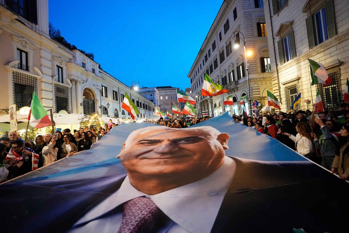 Demonstrators display a banner with Iran's exiled Crown Prince Reza Pahlavi as they gather in Rome, Tuesday, March 3, 2026. (AP Photo/Alessandra Tarantino) Demonstrators display a banner with Iran's exiled Crown Prince Reza Pahlavi as they gather in Rome, Tuesday, March 3, 2026. (AP Photo/Alessandra Tarantino)