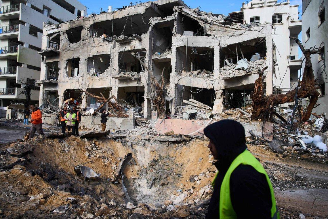 Rescue workers and military personnel survey the scene of a direct hit a day after an Iranian missile struck in Tel Aviv, Israel, Sunday, March 1, 2026. (AP Photo/Oded Balilty) Rescue workers and military personnel survey the scene of a direct hit a day after an Iranian missile struck in Tel Aviv, Israel, Sunday, March 1, 2026. (AP Photo/Oded Balilty)