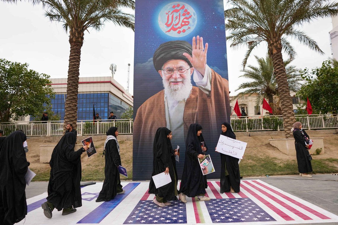 Iraqi step on a representation of an U.S. flag flags and Israeli flag during a protest against U.S. and Israeli attacks on multiple cities across Iran, in Baghdad, Iraq, Thursday, March 12, 2026. (AP Photo/Hadi Mizban) Iraqi step on a representation of an U.S. flag flags and Israeli flag during a protest against U.S. and Israeli attacks on multiple cities across Iran, in Baghdad, Iraq, Thursday, March 12, 2026. (AP Photo/Hadi Mizban)