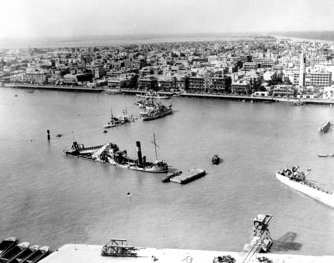 Scuttled ships at the entrance to the Suez Canal, at Port Said, Nov. 19, 1956, as seen from over Port Fuad. Port Said can be seen in the background. Flag poles rising from the water pinpoint other completely sunken ships. (AP Photo) Scuttled ships at the entrance to the Suez Canal, at Port Said, Nov. 19, 1956, as seen from over Port Fuad. Port Said can be seen in the background. Flag poles rising from the water pinpoint other completely sunken ships. (AP Photo)