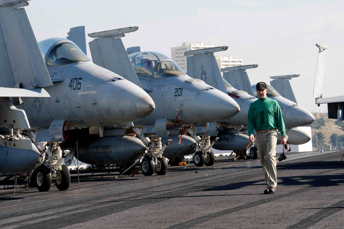 US Navy personnel walk past aircraft on the nuclear powered aircraft carrier USS George H.W. Bush docked for a of four-day stop in the harbour of Marseille, southern France, Saturday, Nov. 1, 2014. The vessel took part in the mission Enduring Freedom in Afghanistan and against the Islamic State group in Iraq. (AP Photo/Claude Paris) US Navy personnel walk past aircraft on the nuclear powered aircraft carrier USS George H.W. Bush docked for a of four-day stop in the harbour of Marseille, southern France, Saturday, Nov. 1, 2014. The vessel took part in the mission Enduring Freedom in Afghanistan and against the Islamic State group in Iraq. (AP Photo/Claude Paris)