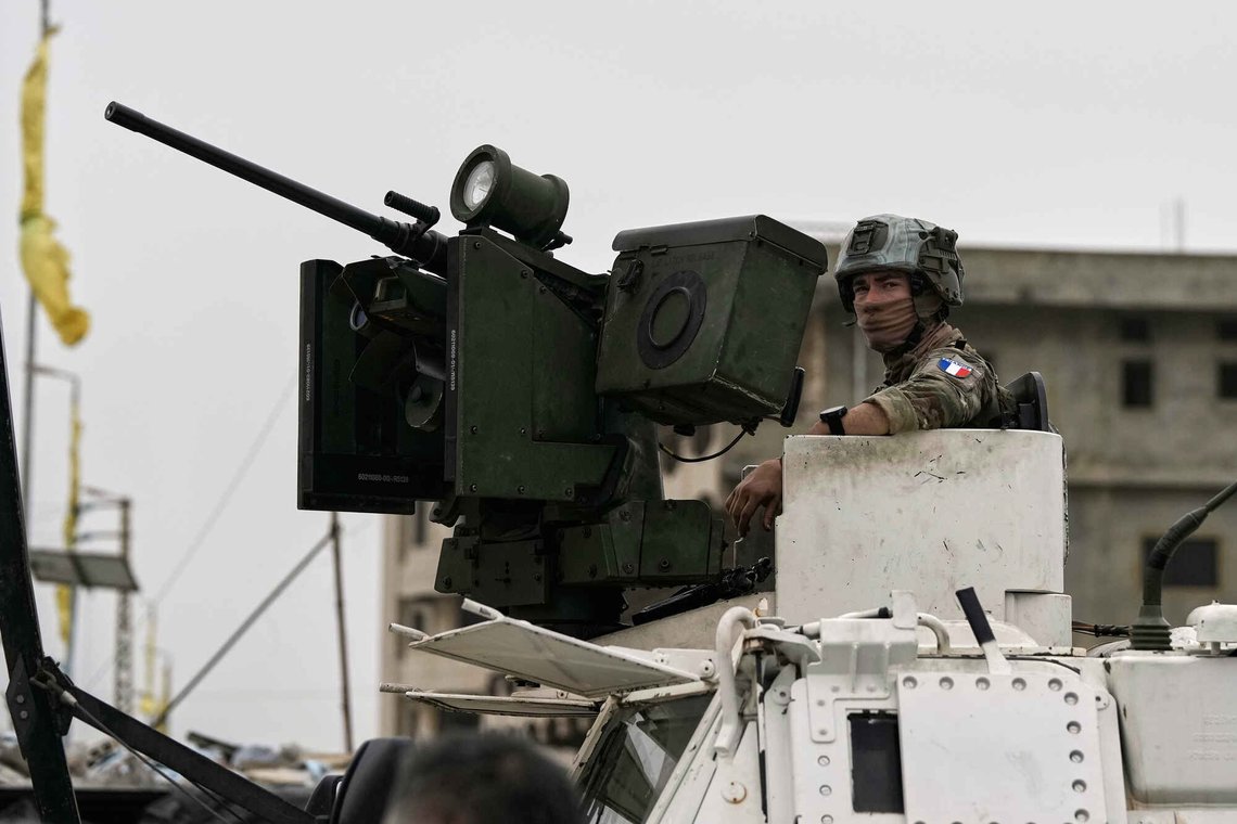 A French U.N peacekeeper sits on an armored personnel carrier at a road used by displaced people to return to their villages on the second day of a ceasefire between Hezbollah and Israel in Qasmiyeh, near Tyre city, southern Lebanon, Saturday, April 18, 2026. (AP Photo/Bilal Hussein) A French U.N peacekeeper sits on an armored personnel carrier at a road used by displaced people to return to their villages on the second day of a ceasefire between Hezbollah and Israel in Qasmiyeh, near Tyre city, southern Lebanon, Saturday, April 18, 2026. (AP Photo/Bilal Hussein)