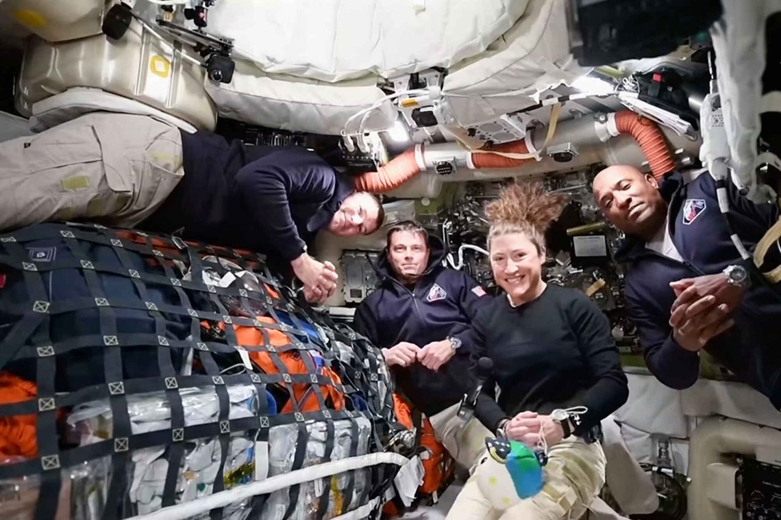 This image taken from video provided by NASA shows the Artemis II crew, from left, Canadien astronaut and mission specialist Jeremy Hansen, Commander Reid Wiseman, mission specialist Christina Koch and pilot Victor Glover as they appear on a video conference from the moon's orbit Thursday, April 2, 2026. (NASA via AP) This image taken from video provided by NASA shows the Artemis II crew, from left, Canadien astronaut and mission specialist Jeremy Hansen, Commander Reid Wiseman, mission specialist Christina Koch and pilot Victor Glover as they appear on a video conference from the moon's orbit Thursday, April 2, 2026. (NASA via AP)