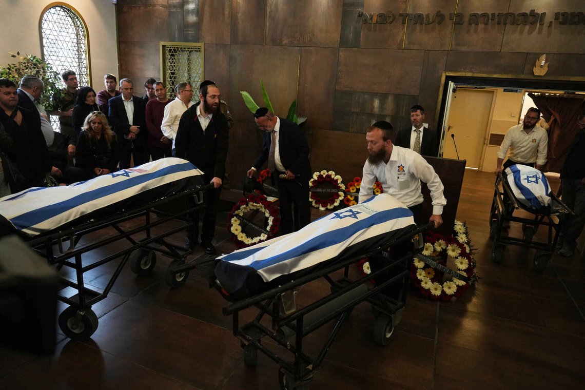 The flag-draped bodies of three members of the Gershovich family, killed when an Iranian missile struck their building, are brought to a cemetery for their funeral in Haifa, Israel, Tuesday, April 7, 2026. (AP Photo/Ariel Schalit) The flag-draped bodies of three members of the Gershovich family, killed when an Iranian missile struck their building, are brought to a cemetery for their funeral in Haifa, Israel, Tuesday, April 7, 2026. (AP Photo/Ariel Schalit)