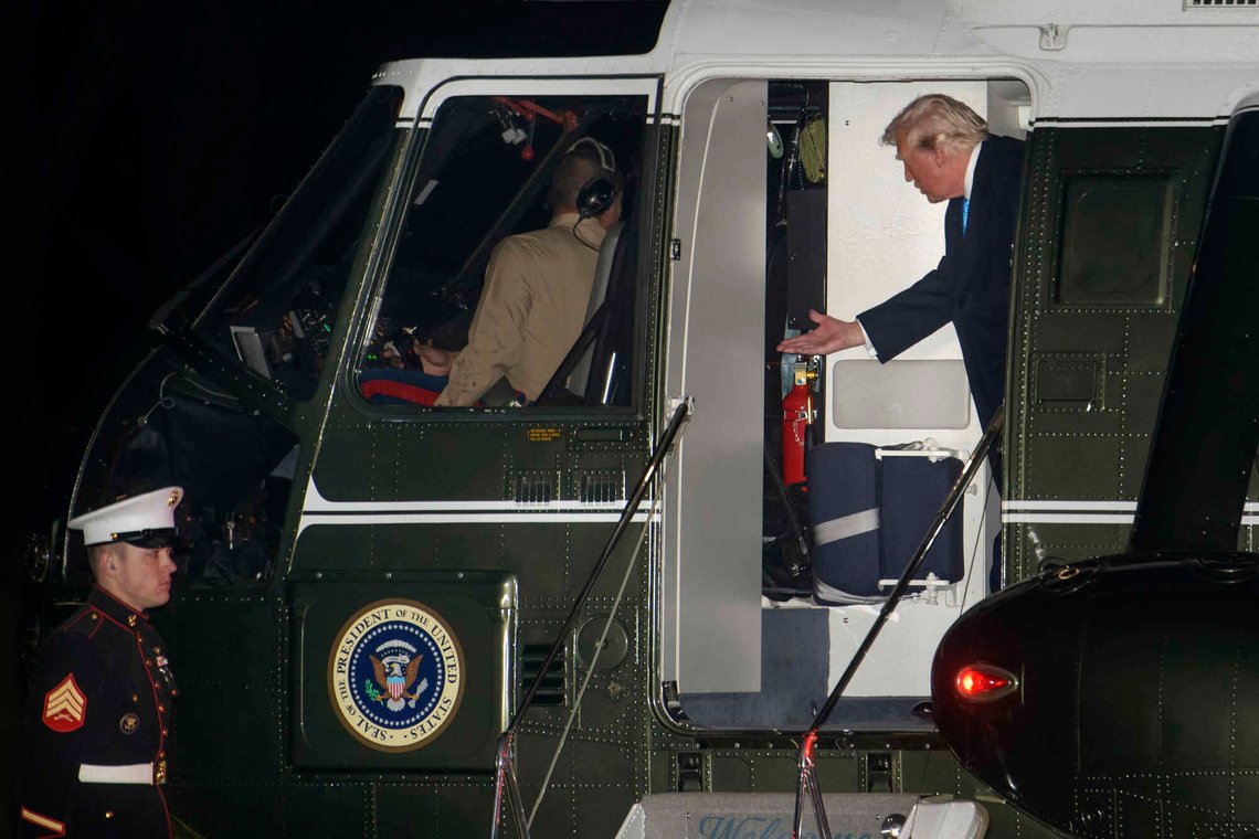 President Donald Trump talks with the pilot as he disembarks Marine One upon arrival on the South Lawn of the White House in Washington, Sunday, Feb. 2, 2025. (AP Photo/Rod Lamkey, Jr.) President Donald Trump talks with the pilot as he disembarks Marine One upon arrival on the South Lawn of the White House in Washington, Sunday, Feb. 2, 2025. (AP Photo/Rod Lamkey, Jr.)
