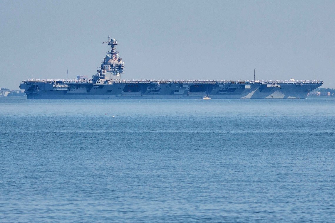 FILE - The USS Gerald R. Ford aircraft carrier leaves Naval Station Norfolk, June 23, 2025, in Norfolk, Va. (AP Photo/John Clark, File) FILE - The USS Gerald R. Ford aircraft carrier leaves Naval Station Norfolk, June 23, 2025, in Norfolk, Va. (AP Photo/John Clark, File)
