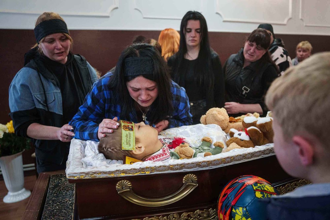 A family members pays her final respects to 8-year-old Bohdan Serhiiev who was killed in a Russian drone attack, during a farewell ceremony in Cherkasy, Ukraine, Thursday, April 16, 2026. (AP Photo/Evgeniy Maloletka) A family members pays her final respects to 8-year-old Bohdan Serhiiev who was killed in a Russian drone attack, during a farewell ceremony in Cherkasy, Ukraine, Thursday, April 16, 2026. (AP Photo/Evgeniy Maloletka)