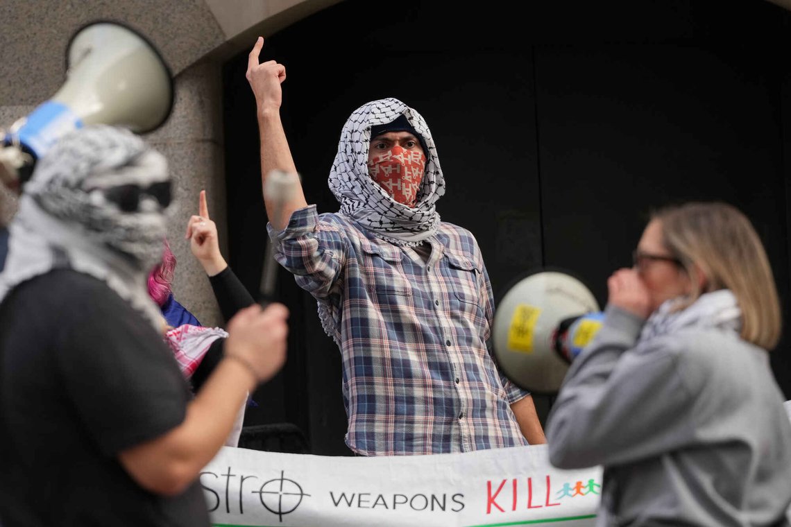 Protesters demonstrate outside The Old Bailey court in London, where four Palestine Action activists are to appear in court charged over a break-in at RAF Brize Norton on June 20 in which aircraft were damaged with spraypaint, Friday, Jan. 16, 2026. (AP Photo/Kirsty Wigglesworth) Protesters demonstrate outside The Old Bailey court in London, where four Palestine Action activists are to appear in court charged over a break-in at RAF Brize Norton on June 20 in which aircraft were damaged with spraypaint, Friday, Jan. 16, 2026. (AP Photo/Kirsty Wigglesworth)