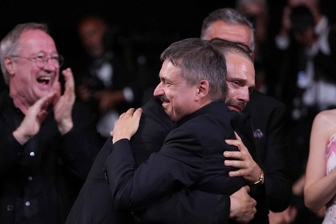 Sebastian Stan, left, embraces Cristian Mungiu, winner of the Palme d'Or for 'Fjord', during the awards ceremony at the 79th international film festival, Cannes, southern France, Saturday, May 23, 2026. (AP Photo/Andreea Alexandru) Sebastian Stan, left, embraces Cristian Mungiu, winner of the Palme d'Or for 'Fjord', during the awards ceremony at the 79th international film festival, Cannes, southern France, Saturday, May 23, 2026. (AP Photo/Andreea Alexandru)