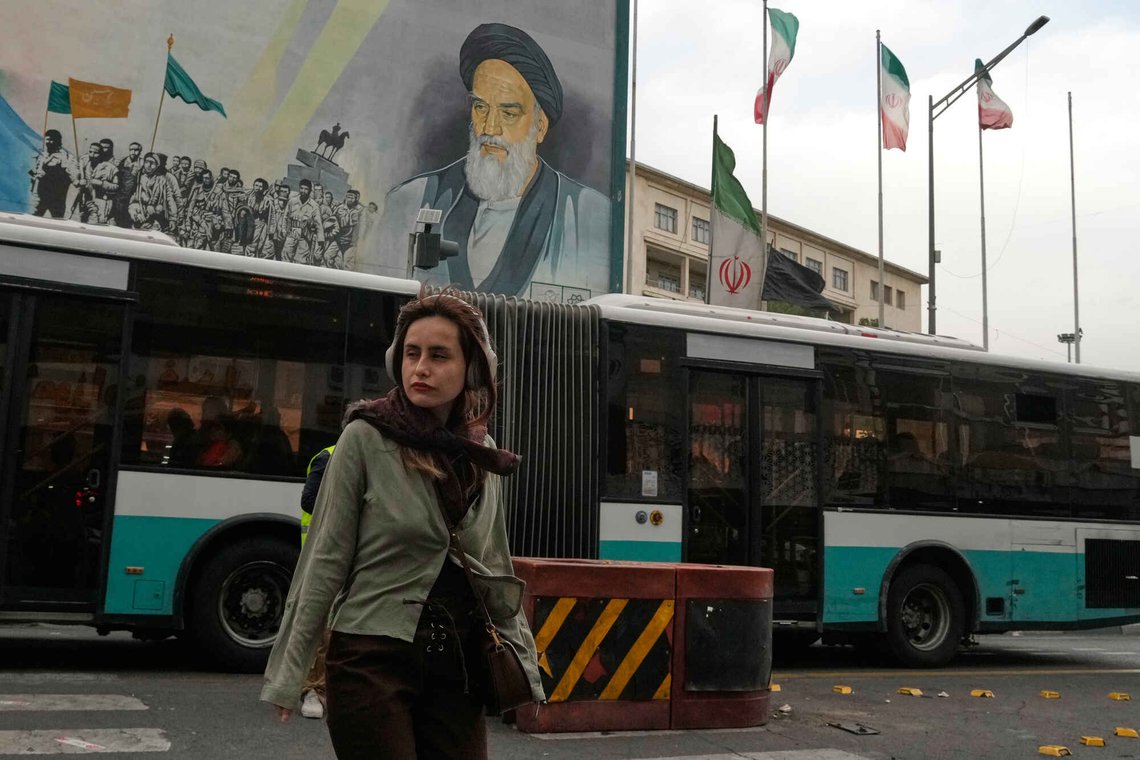 A woman crosses a street in front of a painting of the late Iranian revolutionary founder Ayatollah Khomeini in downtown Tehran, Iran, Sunday, May 24, 2026. (AP Photo/Vahid Salemi) A woman crosses a street in front of a painting of the late Iranian revolutionary founder Ayatollah Khomeini in downtown Tehran, Iran, Sunday, May 24, 2026. (AP Photo/Vahid Salemi)