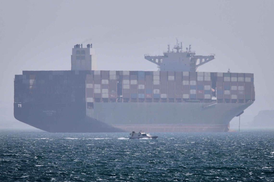 A container ship sits at anchor as a small motorboat passes in the foreground in the Strait of Hormuz off Bandar Abbas, Iran, Saturday, May 2, 2026. (Amirhosein Khorgooi/ISNA via AP) A container ship sits at anchor as a small motorboat passes in the foreground in the Strait of Hormuz off Bandar Abbas, Iran, Saturday, May 2, 2026. (Amirhosein Khorgooi/ISNA via AP)
