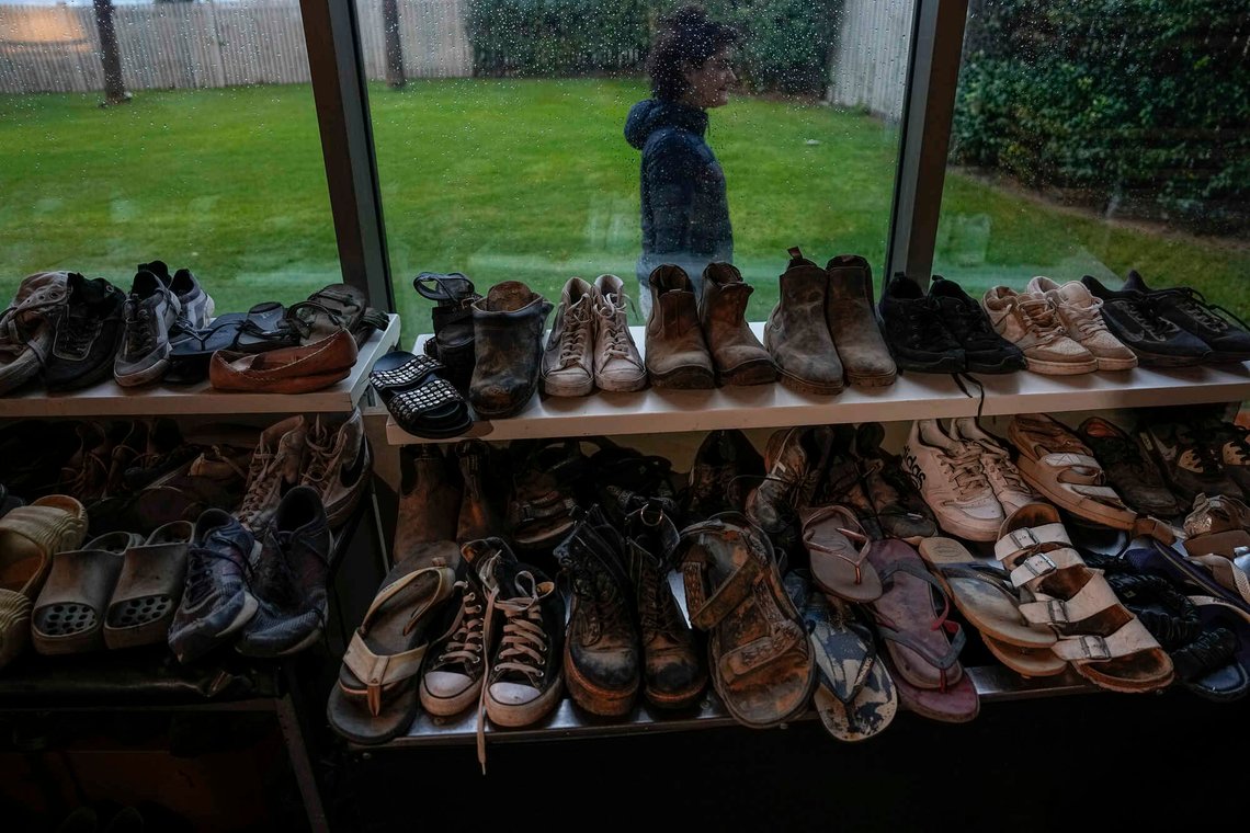Shoes of victims killed during Hamas' attack on the Nova Music Festival are on display as family members are called up to collect them in Kibbutz Sdot Yam, Israel, Nov. 19, 2023. At least 360 Israelis were killed by Hamas militants at the outdoor music festival, among the total 1,200 people killed during Hamas' bloody Oct. 7 cross-border assault. (AP Photo/Ariel Schalit) Shoes of victims killed during Hamas' attack on the Nova Music Festival are on display as family members are called up to collect them in Kibbutz Sdot Yam, Israel, Nov. 19, 2023. At least 360 Israelis were killed by Hamas militants at the outdoor music festival, among the total 1,200 people killed during Hamas' bloody Oct. 7 cross-border assault. (AP Photo/Ariel Schalit)