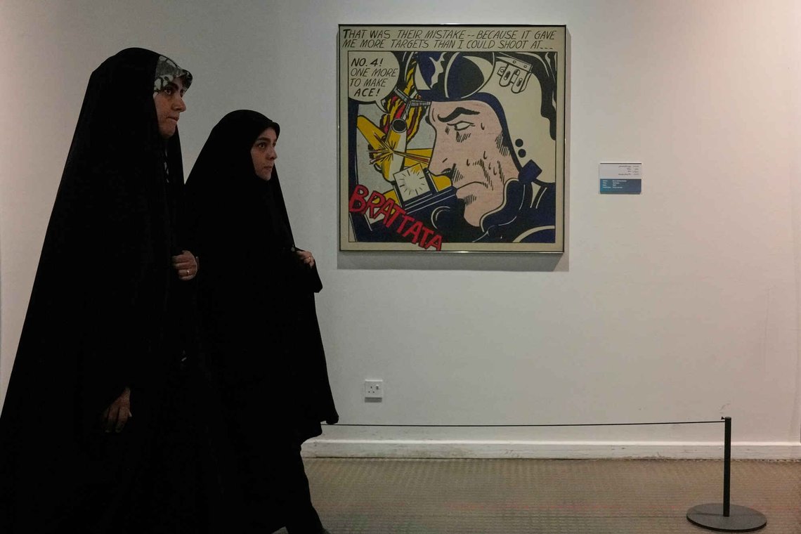 Iranian women walk past American artist Roy Lichtenstein's "Brattata" as they visit an exhibition called: "Art & war" displaying some artworks of American pop artists at the Tehran Museum of Contemporary Art in Iran, Thursday, May 7, 2026. (AP Photo/Vahid Salemi) Iranian women walk past American artist Roy Lichtenstein's "Brattata" as they visit an exhibition called: "Art & war" displaying some artworks of American pop artists at the Tehran Museum of Contemporary Art in Iran, Thursday, May 7, 2026. (AP Photo/Vahid Salemi)