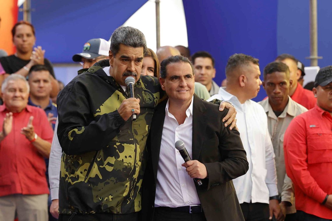 File - Venezuela's President Nicolas Maduro and Alex Saab stand in an embrace during an event marking the anniversary of the 1958 coup that overthrew dictator Marcos Perez Jimenez, in Caracas, Venezuela, Jan. 23, 2024. A Venezuelan businessman who helped hide almost $17 million in bribe payments by an ally of President Nicolas Maduro was sentenced to six months in prison Friday, Feb. 16, 2024, by a federal judge. (AP Photo/Jesus Vargas, File) File - Venezuela's President Nicolas Maduro and Alex Saab stand in an embrace during an event marking the anniversary of the 1958 coup that overthrew dictator Marcos Perez Jimenez, in Caracas, Venezuela, Jan. 23, 2024. A Venezuelan businessman who helped hide almost $17 million in bribe payments by an ally of President Nicolas Maduro was sentenced to six months in prison Friday, Feb. 16, 2024, by a federal judge. (AP Photo/Jesus Vargas, File)