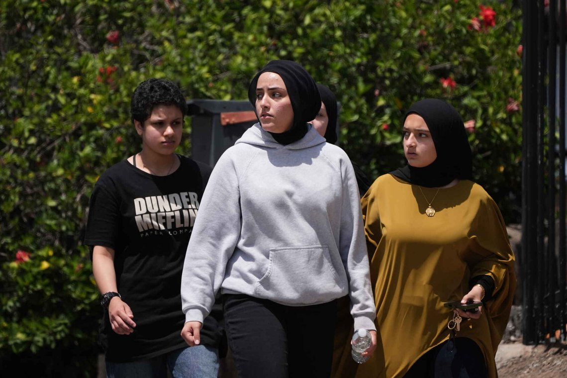 People walk at the scene of a shooting outside the Islamic Center of San Diego Monday, May 18, 2026, in San Diego. (AP Photo/Gregory Bull) People walk at the scene of a shooting outside the Islamic Center of San Diego Monday, May 18, 2026, in San Diego. (AP Photo/Gregory Bull)