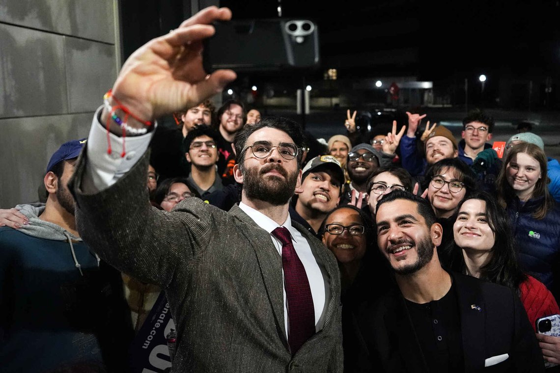 Streamer Hasan Piker, left, and Abdul El-Sayed, a progressive candidate in the Democratic primary for U.S. Senate in Michigan, center right, take a selfie with young fans following a campaign event, Tuesday, April 7, 2026, at the University of Michigan in Ann Arbor, Mich. (AP Photo/Julia Demaree Nikhinson) Streamer Hasan Piker, left, and Abdul El-Sayed, a progressive candidate in the Democratic primary for U.S. Senate in Michigan, center right, take a selfie with young fans following a campaign event, Tuesday, April 7, 2026, at the University of Michigan in Ann Arbor, Mich. (AP Photo/Julia Demaree Nikhinson)
