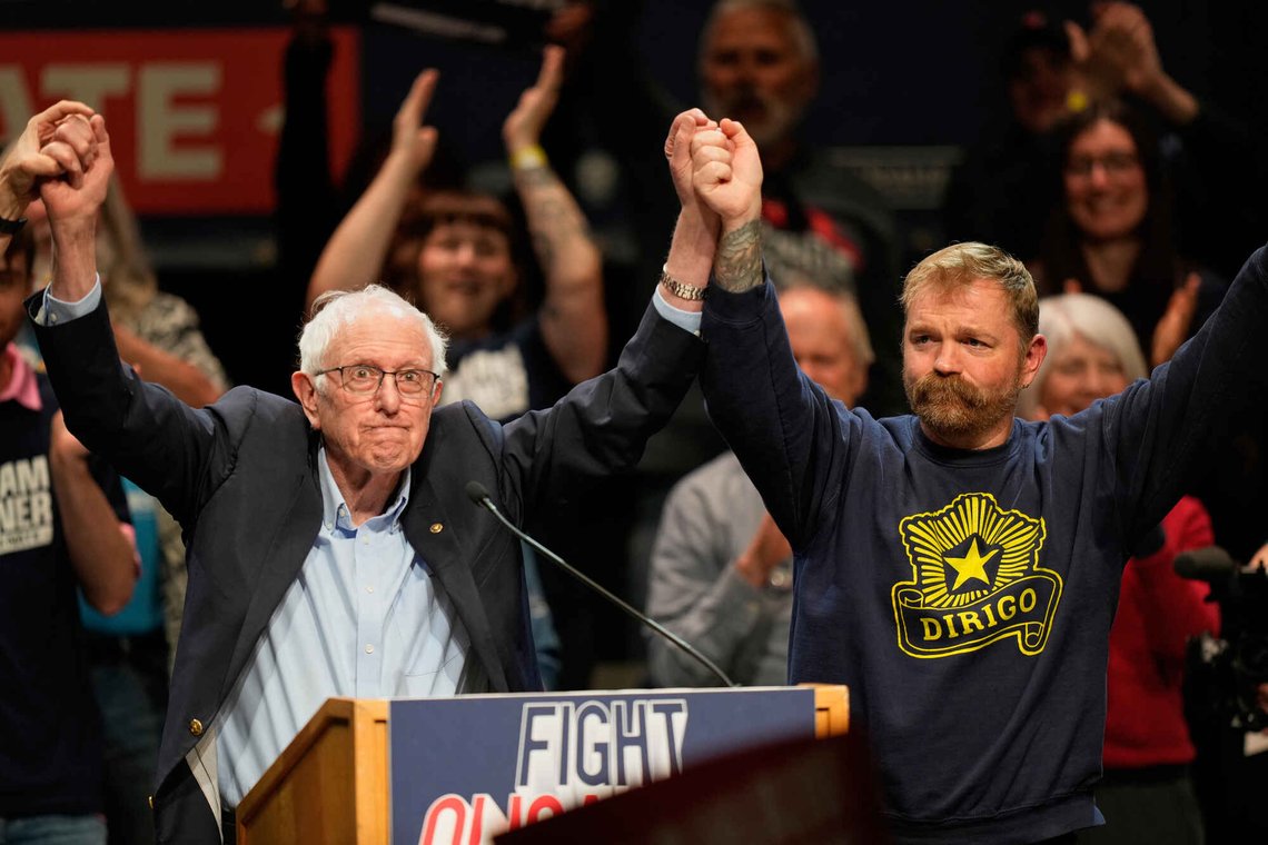 Graham Platner, Democratic candidate for U.S. Senate, and Sen. Bernie Sanders, left, join hands at an event in Orono, Maine, Sunday, May 24, 2026. (AP Photo/Robert F. Bukaty) Graham Platner, Democratic candidate for U.S. Senate, and Sen. Bernie Sanders, left, join hands at an event in Orono, Maine, Sunday, May 24, 2026. (AP Photo/Robert F. Bukaty)