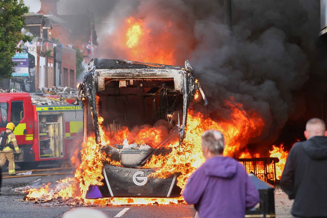 People watch as firemen arrive to put out vehicle that was set alight during a protest in East Belfast following a stabbing incident in Belfast, Tuesday, June 9, 2026. (AP Photo/Peter Morrison) People watch as firemen arrive to put out vehicle that was set alight during a protest in East Belfast following a stabbing incident in Belfast, Tuesday, June 9, 2026. (AP Photo/Peter Morrison)