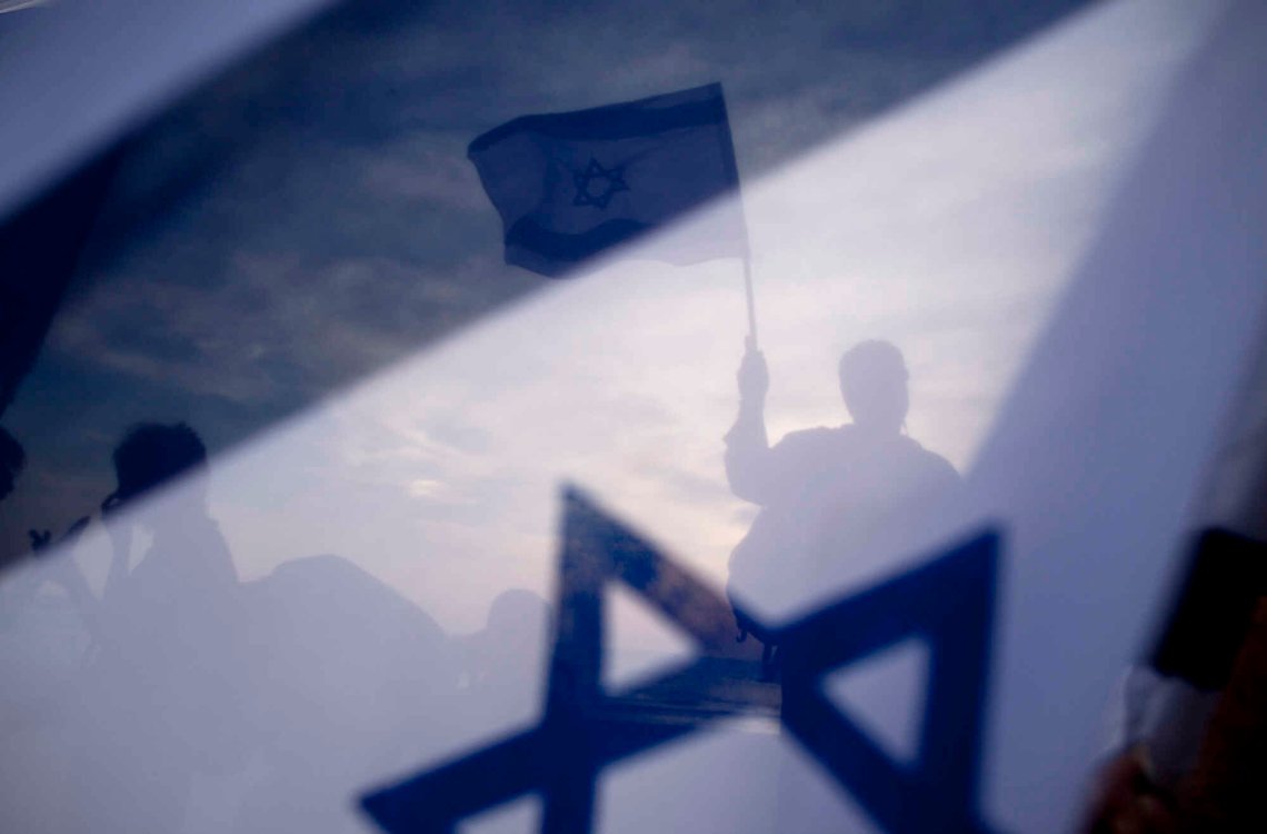 Israeli right wing activists protest outside the US embassy in Tel Aviv, Israel, Sunday, May 22, 2011. US President Barack Obama warned America's pro-Israel lobby on Sunday that the Jewish state will face growing isolation without a credible Middle East peace process. He defended his endorsement of a future Palestine based on Israel's 1967 boundaries but subject to negotiated land swaps as a public expression of long-standing U.S. policy. (AP Photo/Oded Balilty) Israeli right wing activists protest outside the US embassy in Tel Aviv, Israel, Sunday, May 22, 2011. US President Barack Obama warned America's pro-Israel lobby on Sunday that the Jewish state will face growing isolation without a credible Middle East peace process. He defended his endorsement of a future Palestine based on Israel's 1967 boundaries but subject to negotiated land swaps as a public expression of long-standing U.S. policy. (AP Photo/Oded Balilty)