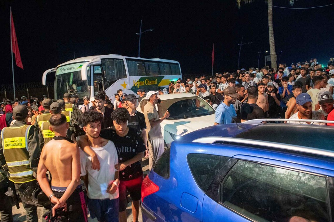Security forces stand guard as people attempt to cross from the northern Moroccan town of Fnideq to the Spanish enclave of Ceuta, Thursday, July 30, 2026. (AP Photo) Security forces stand guard as people attempt to cross from the northern Moroccan town of Fnideq to the Spanish enclave of Ceuta, Thursday, July 30, 2026. (AP Photo)