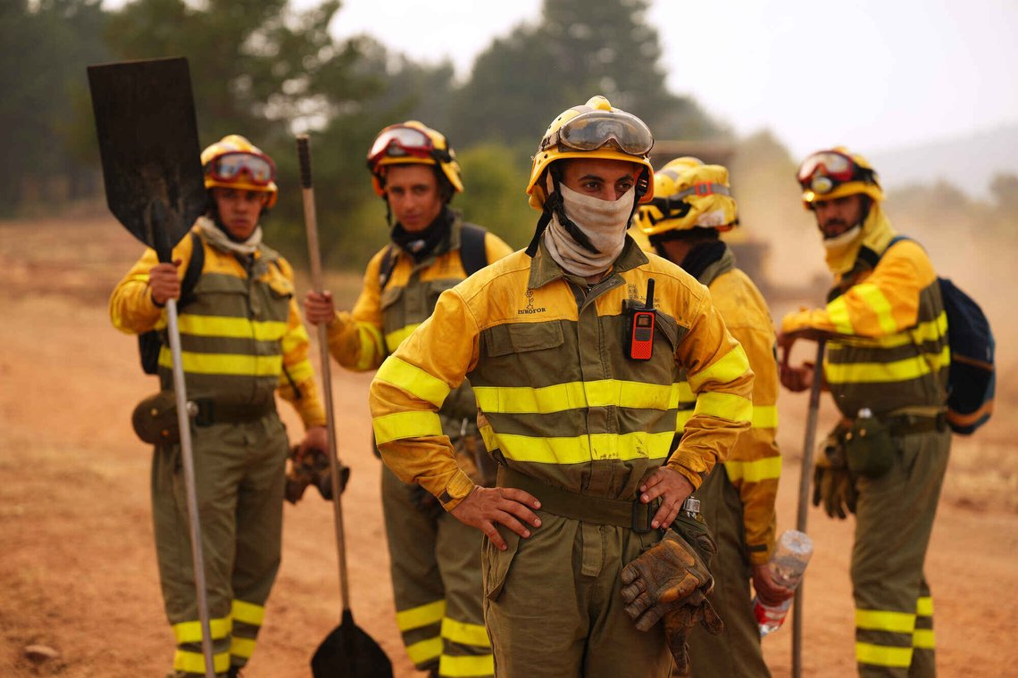 Forest rangers take a break before returning to work on the fire near Condemios de Arriba, Guadalajara province, Spain, Wednesday, July 22, 2026, after a wildfire scorched tens of thousands of hectares in one of Spain's largest wildfires in recent years. (AP Photo/Manu Fernandez) Forest rangers take a break before returning to work on the fire near Condemios de Arriba, Guadalajara province, Spain, Wednesday, July 22, 2026, after a wildfire scorched tens of thousands of hectares in one of Spain's largest wildfires in recent years. (AP Photo/Manu Fernandez)