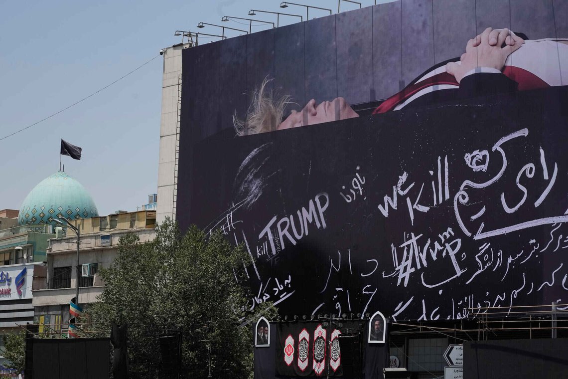 A billboard depicting U.S. President Donald Trump lying on what appears to be a coffin and bearing anti-Trump messages, including the phrase "We Kill Trump," is seen at Islamic Revolution Square in downtown Tehran, Iran, Wednesday, July 15, 2026. (AP Photo/Vahid Salemi) A billboard depicting U.S. President Donald Trump lying on what appears to be a coffin and bearing anti-Trump messages, including the phrase "We Kill Trump," is seen at Islamic Revolution Square in downtown Tehran, Iran, Wednesday, July 15, 2026. (AP Photo/Vahid Salemi)