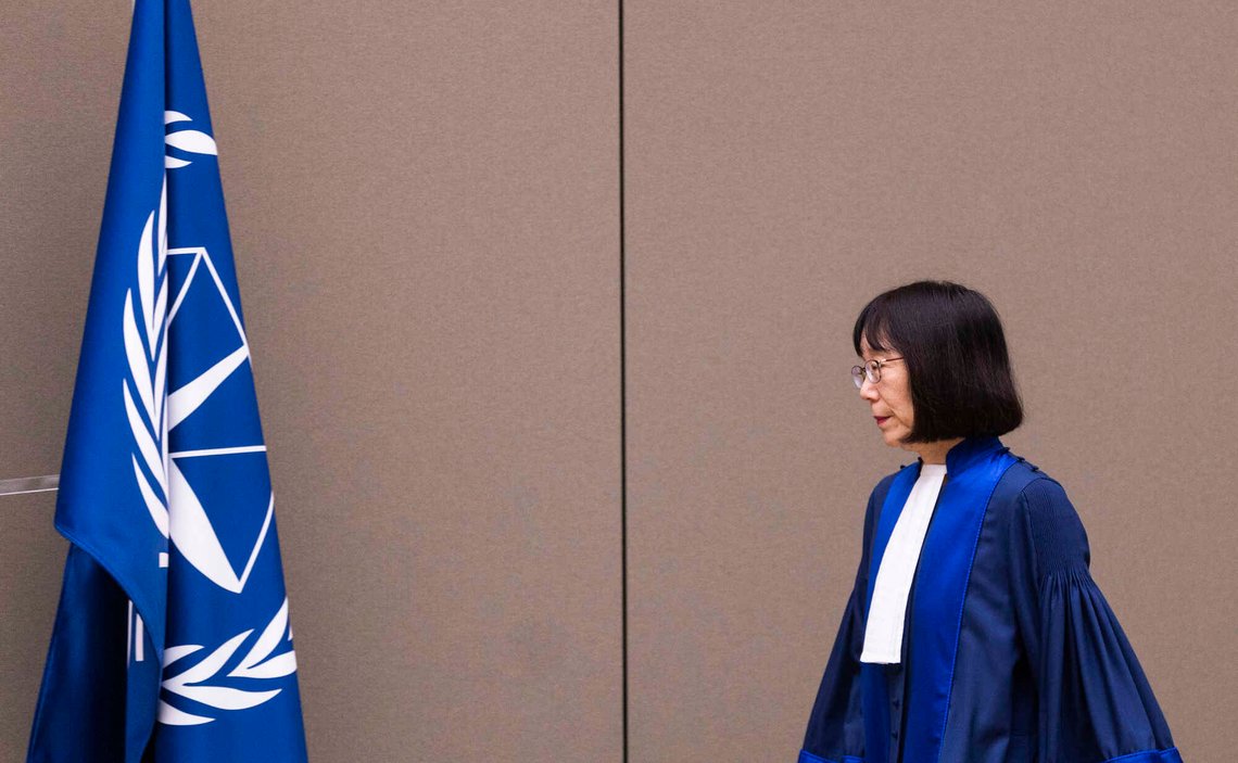 Judge Tomoko Akane walks before delivering the verdict in the Al Hassan case at the International Criminal Court in The Hague, Netherlands, Wednesday Nov. 20, 2024. (Eva Plevier/ ANP via AP, Pool) Judge Tomoko Akane walks before delivering the verdict in the Al Hassan case at the International Criminal Court in The Hague, Netherlands, Wednesday Nov. 20, 2024. (Eva Plevier/ ANP via AP, Pool)