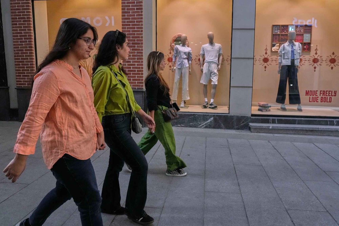 Women walk past windows of a cloths shop at a market in northern Tehran, Iran, Thursday, Aug. 20, 2026. (AP Photo/Vahid Salemi). Women walk past windows of a cloths shop at a market in northern Tehran, Iran, Thursday, Aug. 20, 2026. (AP Photo/Vahid Salemi).