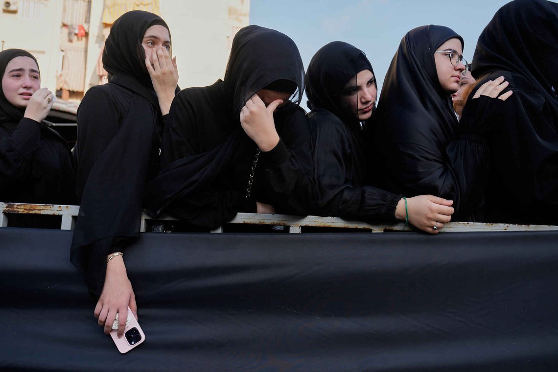 Mourners mourn during the funeral of a Hezbollah member Ali al-Haj Hassan, his wife and his four children, who were killed on Saturday by an Israeli airstrike, in the southern suburb of Beirut, Lebanon, Sunday, Aug. 16, 2026. (AP Photo/Hussein Malla) Mourners mourn during the funeral of a Hezbollah member Ali al-Haj Hassan, his wife and his four children, who were killed on Saturday by an Israeli airstrike, in the southern suburb of Beirut, Lebanon, Sunday, Aug. 16, 2026. (AP Photo/Hussein Malla)