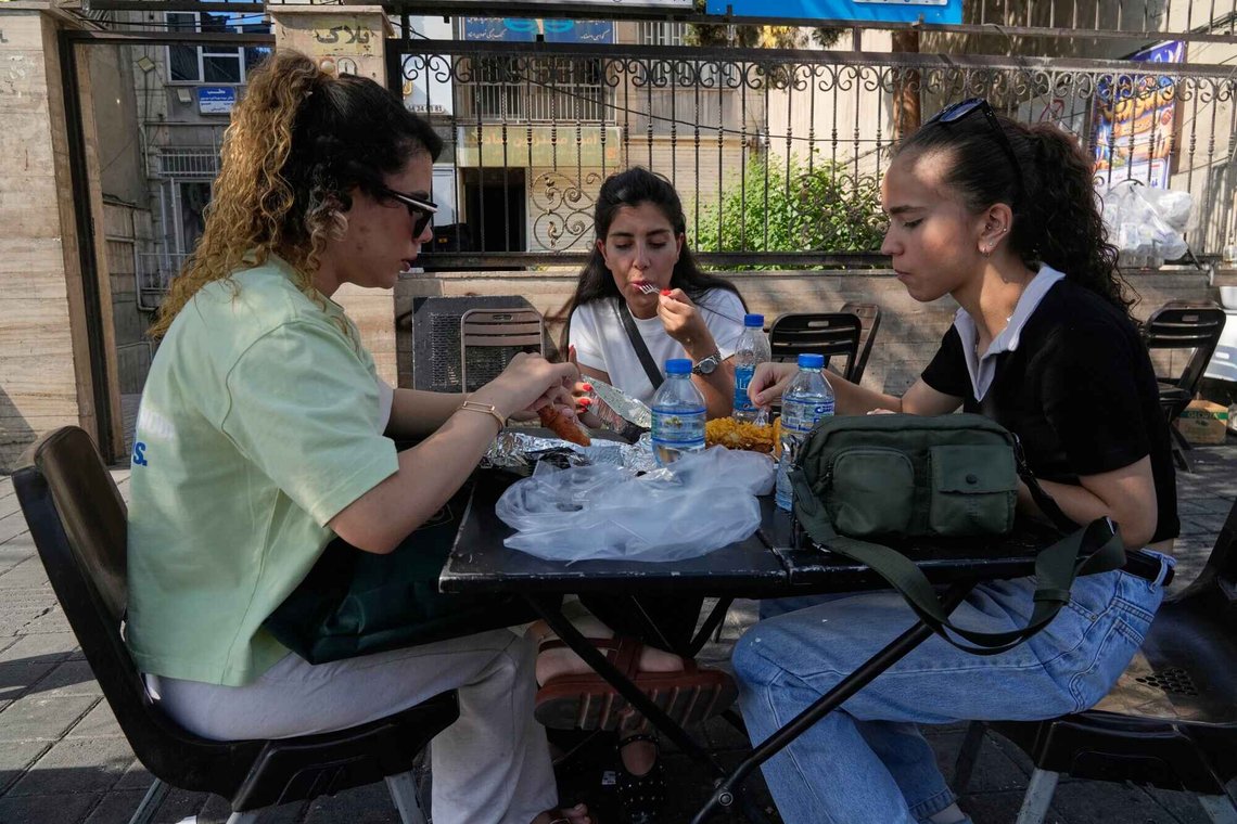 Women enjoy their meal in the outdoor area of a restaurant in Tehran, Iran, Monday, Aug. 10, 2026. (AP Photo/Vahid Salemi) Women enjoy their meal in the outdoor area of a restaurant in Tehran, Iran, Monday, Aug. 10, 2026. (AP Photo/Vahid Salemi)