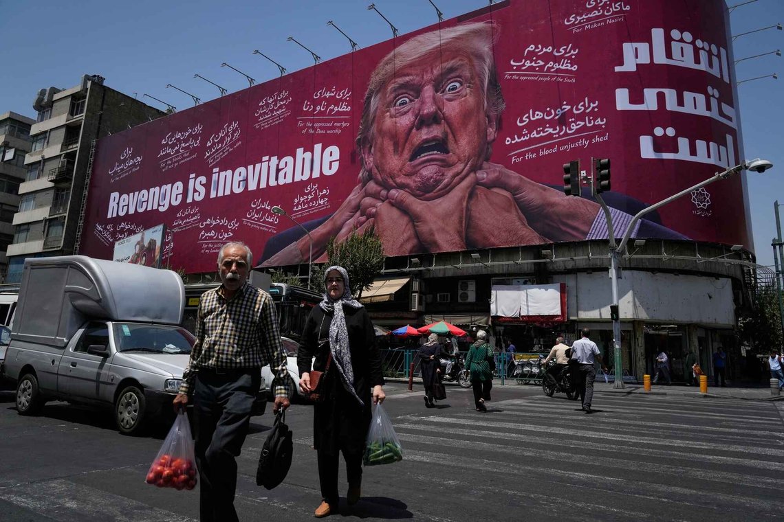 Pedestrians walk past a billboard depicting U.S. President Donald Trump being grabbed by the neck alongside the message "Revenge is inevitable" in English and Farsi, in Tehran, Iran, Monday, July 27, 2026. (AP Photo/Vahid Salemi) Pedestrians walk past a billboard depicting U.S. President Donald Trump being grabbed by the neck alongside the message "Revenge is inevitable" in English and Farsi, in Tehran, Iran, Monday, July 27, 2026. (AP Photo/Vahid Salemi)