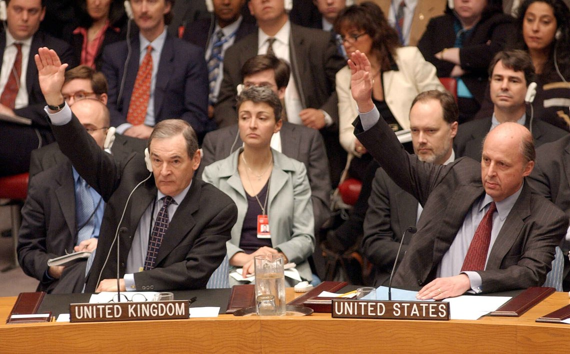 Ambassador John Negroponte, right, and Britain's Ambassador Jeremy Greenstock raise their hands to vote on a resoultion on Iraq in the United Nations Security Council in this May 22, 2003 photo. In this photo, the UN Security Council overwhelmingly approved a resolution giving the United Nations' backing to the U.S.-led administration of Iraq and lifting economic sanctions. President George W. Bush on Thursday named Negroponte, a former U.S. ambassador to the United Nations and currently the administration's top representative in Iraq, to be America's first national intelligence director. (AP Photo/Richard Drew) Ambassador John Negroponte, right, and Britain's Ambassador Jeremy Greenstock raise their hands to vote on a resoultion on Iraq in the United Nations Security Council in this May 22, 2003 photo. In this photo, the UN Security Council overwhelmingly approved a resolution giving the United Nations' backing to the U.S.-led administration of Iraq and lifting economic sanctions. President George W. Bush on Thursday named Negroponte, a former U.S. ambassador to the United Nations and currently the administration's top representative in Iraq, to be America's first national intelligence director. (AP Photo/Richard Drew)