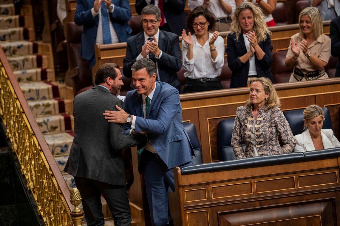 Acting Prime Minister Pedro Sanchez shakes hands with party member Oscar Puente, left, at the Spanish parliament's lower house in Madrid, Spain on Tuesday, Sept. 26, 2023. The leader of Spain's conservatives Alberto Nunez Feijoo is trying to win the endorsement of the nation's parliament to form a new government. Spain's July 23 national election gave Feijoo's Popular Party the most seats in the parliament's 350-member lower chamber but well shy of an absolute majority, Feijoo faces two investiture votes there, one on Wednesday and another on Friday, that will determine whether he can become prime minister. (AP Photo/Bernat Armangue) Acting Prime Minister Pedro Sanchez shakes hands with party member Oscar Puente, left, at the Spanish parliament's lower house in Madrid, Spain on Tuesday, Sept. 26, 2023. The leader of Spain's conservatives Alberto Nunez Feijoo is trying to win the endorsement of the nation's parliament to form a new government. Spain's July 23 national election gave Feijoo's Popular Party the most seats in the parliament's 350-member lower chamber but well shy of an absolute majority, Feijoo faces two investiture votes there, one on Wednesday and another on Friday, that will determine whether he can become prime minister. (AP Photo/Bernat Armangue)