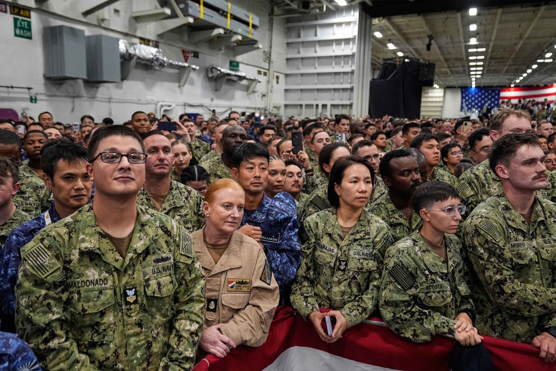 Members of the military listen to President Donald Trump speak, aboard the USS George Washington, an aircraft carrier docked at an American naval base, in Yokosuka, Tuesday, Oct. 28, 2025. (AP Photo/Mark Schiefelbein) Members of the military listen to President Donald Trump speak, aboard the USS George Washington, an aircraft carrier docked at an American naval base, in Yokosuka, Tuesday, Oct. 28, 2025. (AP Photo/Mark Schiefelbein)